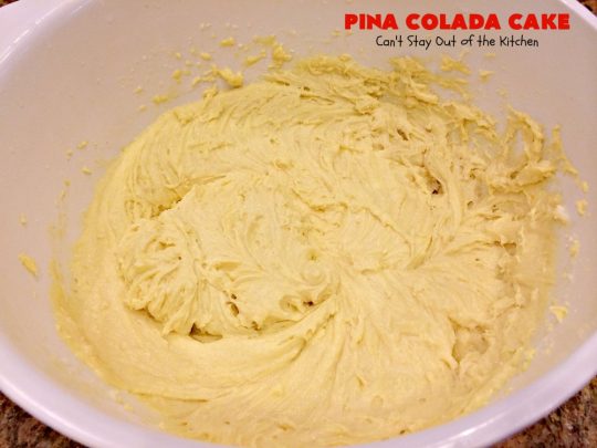 Pina Colada Cake | Can't Stay Out of the Kitchen | Best #PinaColada cake ever! This amazing #pokecake uses cream of coconut & sweetened condensed milk to make it exceptionally moist. It's terrific for potlucks, special occasions & #holidays. 