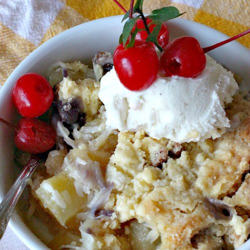 Pina Colada Dump Cake Cobbler | Can't Stay Out of the Kitchen | this easy 6-ingredient #dessert will have you salivating from the first bite. It's so easy to toss together that it's perfect for potlucks, company desserts or family dinners. #PinaColada #PinaColadaDessert #cobbler #pineapple #DumpCake #coconut #PinaColadaDumpCakeCobbler