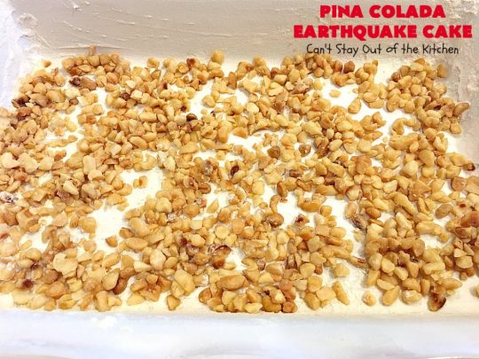Pina Colada Earthquake Cake | Can't Stay Out of the Kitchen | best #cake ever! This heavenly #dessert is filled with #pineapple, #coconut, macadamia nuts & vanilla chips. #Creamcheese frosting bakes into the cake causing it to crater, erupt & explode in an earthquake! Perfect for #holidays or special occasions. 