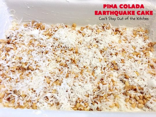 Pina Colada Earthquake Cake | Can't Stay Out of the Kitchen | best #cake ever! This heavenly #dessert is filled with #pineapple, #coconut, macadamia nuts & vanilla chips. #Creamcheese frosting bakes into the cake causing it to crater, erupt & explode in an earthquake! Perfect for #holidays or special occasions. 