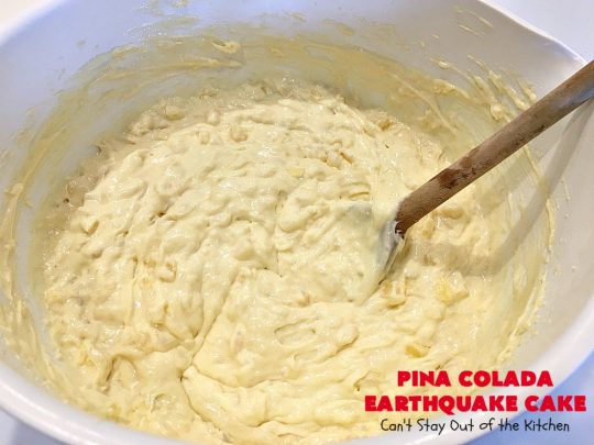 Pina Colada Earthquake Cake | Can't Stay Out of the Kitchen | best #cake ever! This heavenly #dessert is filled with #pineapple, #coconut, macadamia nuts & vanilla chips. #Creamcheese frosting bakes into the cake causing it to crater, erupt & explode in an earthquake! Perfect for #holidays or special occasions. 