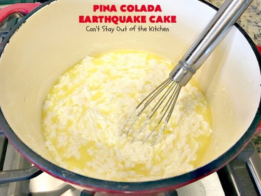 Pina Colada Earthquake Cake | Can't Stay Out of the Kitchen | best #cake ever! This heavenly #dessert is filled with #pineapple, #coconut, macadamia nuts & vanilla chips. #Creamcheese frosting bakes into the cake causing it to crater, erupt & explode in an earthquake! Perfect for #holidays or special occasions. 
