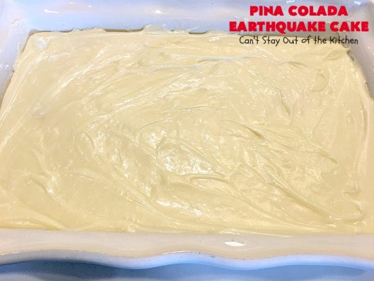 Pina Colada Earthquake Cake | Can't Stay Out of the Kitchen | best #cake ever! This heavenly #dessert is filled with #pineapple, #coconut, macadamia nuts & vanilla chips. #Creamcheese frosting bakes into the cake causing it to crater, erupt & explode in an earthquake! Perfect for #holidays or special occasions. 