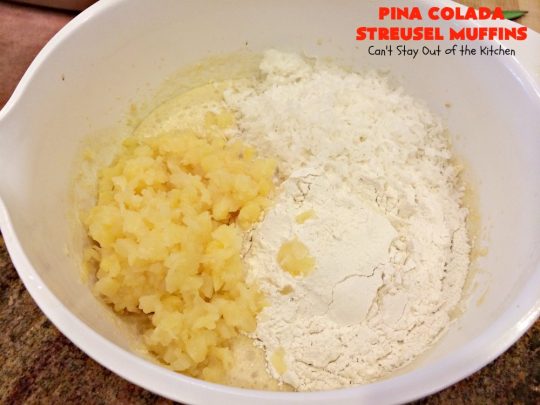 Pina Colada Streusel Muffins | Can't Stay Out of the Kitchen | Invite the Islands into your house for #Easter #Breakfast with these spectacular #muffins. They're filled with #Pineapple, #Coconut & #MacadamiaNuts for a rich, even decadent #BreakfastMuffin that you'll drool over! #Holiday #GreekYogurt #HolidayBreakfast #EasterBreakfast #MothersDayBreakfast #PinaColada #PinaColadaStreuselMuffins
