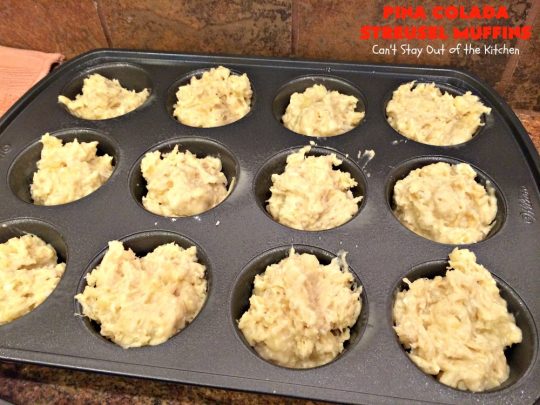 Pina Colada Streusel Muffins | Can't Stay Out of the Kitchen | Invite the Islands into your house for #Easter #Breakfast with these spectacular #muffins. They're filled with #Pineapple, #Coconut & #MacadamiaNuts for a rich, even decadent #BreakfastMuffin that you'll drool over! #Holiday #GreekYogurt #HolidayBreakfast #EasterBreakfast #MothersDayBreakfast #PinaColada #PinaColadaStreuselMuffins