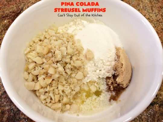 Pina Colada Streusel Muffins | Can't Stay Out of the Kitchen | Invite the Islands into your house for #Easter #Breakfast with these spectacular #muffins. They're filled with #Pineapple, #Coconut & #MacadamiaNuts for a rich, even decadent #BreakfastMuffin that you'll drool over! #Holiday #GreekYogurt #HolidayBreakfast #EasterBreakfast #MothersDayBreakfast #PinaColada #PinaColadaStreuselMuffins