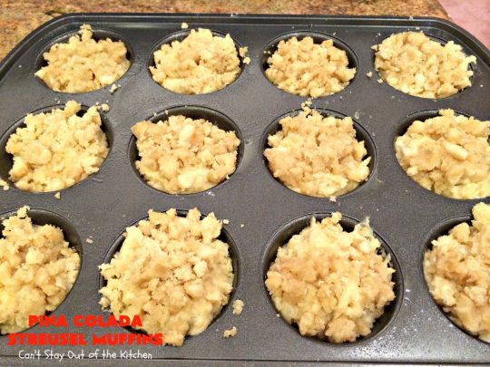 Pina Colada Streusel Muffins | Can't Stay Out of the Kitchen | Invite the Islands into your house for #Easter #Breakfast with these spectacular #muffins. They're filled with #Pineapple, #Coconut & #MacadamiaNuts for a rich, even decadent #BreakfastMuffin that you'll drool over! #Holiday #GreekYogurt #HolidayBreakfast #EasterBreakfast #MothersDayBreakfast #PinaColada #PinaColadaStreuselMuffins