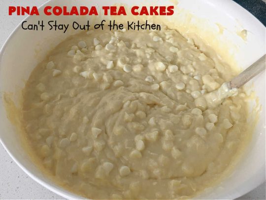 Pina Colada Tea Cakes | Can't Stay Out of the Kitchen | these scrumptious #TeaCakes are packed with #PinaColada flavor including a #Pineapple cake mix, pineapple gelatin, vanilla chips & #coconut. They're glazed with a luscious powdered sugar icing too. These miniature #Bundt #cakes are marvelous for #holiday or #Christmas baking. #HolidayDessert #PinaColadaDessert #PinaColadaTeaCakes