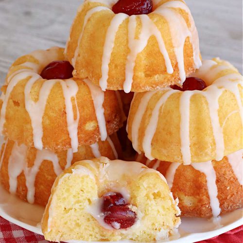 Pina Colada Tea Cakes | Can't Stay Out of the Kitchen | these scrumptious #TeaCakes are packed with #PinaColada flavor including a #Pineapple cake mix, pineapple gelatin, vanilla chips & #coconut. They're glazed with a luscious powdered sugar icing too. These miniature #Bundt #cakes are marvelous for #holiday or #Christmas baking. #HolidayDessert #PinaColadaDessert #PinaColadaTeaCakes