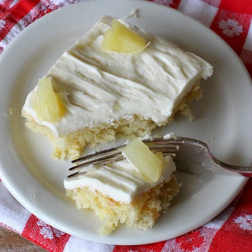 Pineapple Explosion | Can't Stay Out of the Kitchen | get quadruple the #pineapple whammy with #PineappleCakeMix & #PineapplePieFilling in the #cake & #PineappleExtract & #PineappleTidbits in the luscious #CreamCheese icing! Knock the socks off your company with this amazing #dessert! #Holiday #HolidayDessert #PineappleDessert #PineappleSheetCake #PineappleExplosion #PineappleExplosionCake