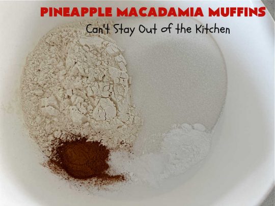 Pineapple Macadamia Muffins | Can't Stay Out of the Kitchen | these scrumptious #muffins will knock our socks off! They include crushed #pineapple, #bananas, #coconut #cinnamon & #MacadamiaNuts for the topping. They're easy to whip up, & great to make for a weekend, company or #holiday #breakfast. They freeze well if you need to make them in advance. #PineappleMacadamiaMuffins