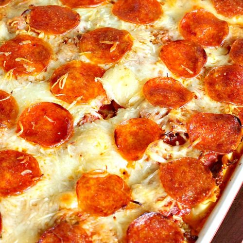 Ten Layer Pizza Casserole | Can't Stay Out of the Kitchen | This fantastic #casserole tastes like eating #pizza or #lasagna. It's filled with #GroundBeef, #noodles, #pepperoni #RicottaCheese, #Mozzarella Cheese & amped up #SpaghettiSauce. Our company raved over this #Italian #MainDish. #PizzaCasserole #TenLayerPizzaCasserole