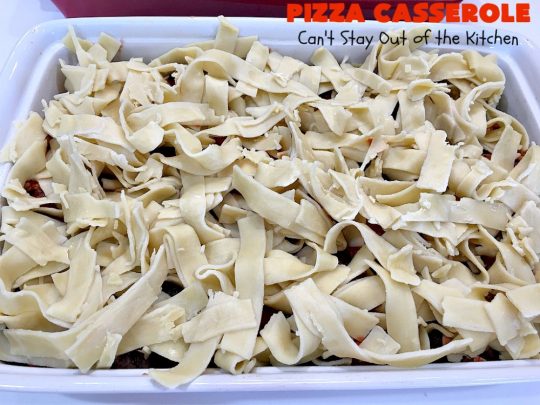 Ten Layer Pizza Casserole | Can't Stay Out of the Kitchen | This fantastic #casserole tastes like eating #pizza or #lasagna. It's filled with #GroundBeef, #noodles, #pepperoni #RicottaCheese, #Mozzarella Cheese & amped up #SpaghettiSauce. Our company raved over this #Italian #MainDish. #PizzaCasserole #TenLayerPizzaCasserole