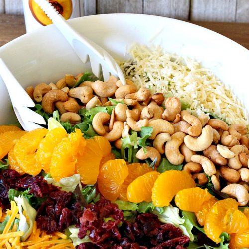 Poppyseed Mandarin Salad | Can't Stay Out of the Kitchen | this quick & easy #salad uses only 7 ingredients including the #SaladDressing. The contrasting savory & sweet flavors are delightful. Great for weeknight dinners. #GlutenFree #MandarinOranges #cashews #CheddarCheese #SwissCheese #cranberries #PoppyseedMandarinSalad