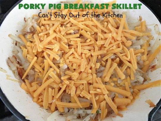 Porky Pig Breakfast Skillet | Can't Stay Out of the Kitchen | this hearty and amazing #BreakfastSkillet includes #eggs, "HashBrowns, two kinds of #cheese, #ham, #sausage & #bacon. It's absolutely the most mouthwatering #skillet #breakfast ever! If you enjoy hearty breakfasts, this one is amazing. #pork #SkilletBreakfast #PorkyPigBreakfastSkillet #Holiday #HolidayBreakfast