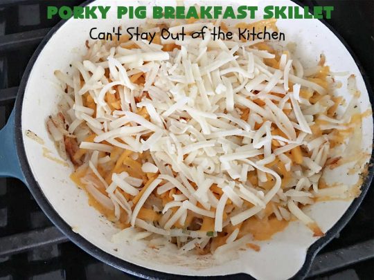 Porky Pig Breakfast Skillet | Can't Stay Out of the Kitchen | this hearty and amazing #BreakfastSkillet includes #eggs, "HashBrowns, two kinds of #cheese, #ham, #sausage & #bacon. It's absolutely the most mouthwatering #skillet #breakfast ever! If you enjoy hearty breakfasts, this one is amazing. #pork #SkilletBreakfast #PorkyPigBreakfastSkillet #Holiday #HolidayBreakfast