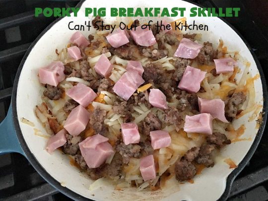 Porky Pig Breakfast Skillet | Can't Stay Out of the Kitchen | this hearty and amazing #BreakfastSkillet includes #eggs, "HashBrowns, two kinds of #cheese, #ham, #sausage & #bacon. It's absolutely the most mouthwatering #skillet #breakfast ever! If you enjoy hearty breakfasts, this one is amazing. #pork #SkilletBreakfast #PorkyPigBreakfastSkillet #Holiday #HolidayBreakfast