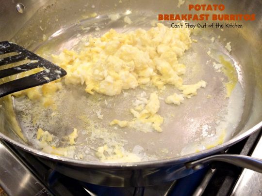 Potato Breakfast Burritos | Can't Stay Out of the Kitchen | these #BreakfastBurritos are heavenly! Warm #tortillas are filled with seasoned #FriedPotatoes, #eggs & #CheddarCheese. They are so mouthwatering, hearty, filling & totally satisfying for #breakfast or #MeatlessMondays. These can be made up ahead then microwaved when you're on the way out the door! #potatoes #burritos #TexMex #TexMexBreakfastBurritos #Holiday #PotatoBreakfastBurritos #HolidayBreakfast