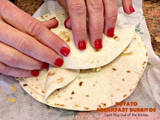Potato Breakfast Burritos | Can't Stay Out of the Kitchen | these #BreakfastBurritos are heavenly! Warm #tortillas are filled with seasoned #FriedPotatoes, #eggs & #CheddarCheese. They are so mouthwatering, hearty, filling & totally satisfying for #breakfast or #MeatlessMondays. These can be made up ahead then microwaved when you're on the way out the door! #potatoes #burritos #TexMex #TexMexBreakfastBurritos #Holiday #PotatoBreakfastBurritos #HolidayBreakfast