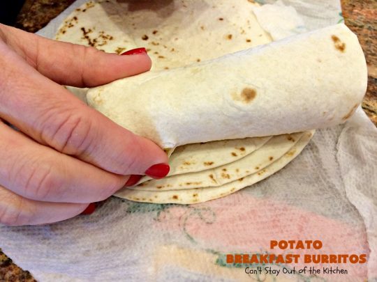 Potato Breakfast Burritos | Can't Stay Out of the Kitchen | these #BreakfastBurritos are heavenly! Warm #tortillas are filled with seasoned #FriedPotatoes, #eggs & #CheddarCheese. They are so mouthwatering, hearty, filling & totally satisfying for #breakfast or #MeatlessMondays. These can be made up ahead then microwaved when you're on the way out the door! #potatoes #burritos #TexMex #TexMexBreakfastBurritos #Holiday #PotatoBreakfastBurritos #HolidayBreakfast