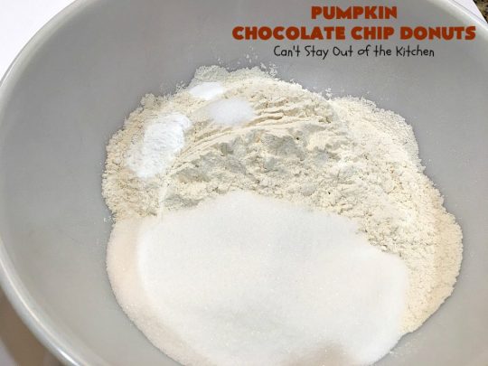 Pumpkin Chocolate Chip Donuts | Can't Stay Out of the Kitchen | these phenomenal #donuts are so mouthwatering. They have double the #chocolate & double the #pumpkin flavor. You'll be drooling over every mouthful. Highly recommended for #MothersDay or #FathersDay #Breakfast. #Holiday #HolidayBreakfast #PumpkinDonuts #ChocolateChipDonuts #fall #FallBaking #PumpkinChocolateChipDonuts #ChocolateChips