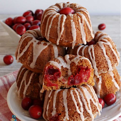 Pumpkin Cranberry Tea Cakes | Can't Stay Out of the Kitchen | these luscious #TeaCakes contain both #pumpkin & #cranberries. Plus, they're iced with a luscious #cinnamon frosting. They're marvelous for #holiday or #Christmas #baking & parties. Prepare to swoon after just one bite! #dessert #cake #HolidayDessert #PumpkinDessert #CranberryDessert #PumpkinCranberryTeaCakes