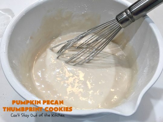 Pumpkin Pecan Thumbprint Cookies | Can't Stay Out of the Kitchen | these delectable #cookies use a #pumpkin #pecan butter then they're glazed with a vanilla icing. They're wonderful for #holiday or #Christmas parties or #ChristmasCookieExchanges. #ChristmasCookie #WilliamsSonoma #PecanPumpkinButter #MuirheadPecanPumpkinButter #cookies #ThumbprintCookies #dessert #Fall #FallBaking #HolidayDessert #ChristmasDessert