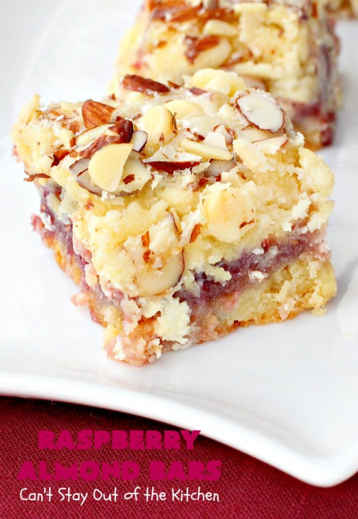 Raspberry Almond Bars | Can't Stay Out of the Kitchen | these irresistible #brownies are rich, decadent & absolutely sensational! They're perfect for #holiday & #Christmas #baking as they are so festive & beautiful. These layered #cookies use vanilla chips, #Raspberry preserves & #almonds. #holidaybaking #ChristmasCookieExchange #dessert #raspberrydessert