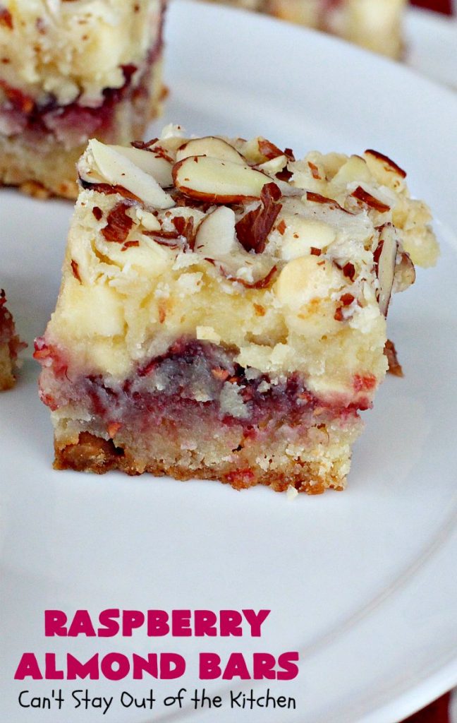 Raspberry Almond Bars | Can't Stay Out of the Kitchen | these irresistible #brownies are rich, decadent & absolutely sensational! They're perfect for #holiday & #Christmas #baking as they are so festive & beautiful. These layered #cookies use vanilla chips, #Raspberry preserves & #almonds. #holidaybaking #ChristmasCookieExchange #dessert #raspberrydessert