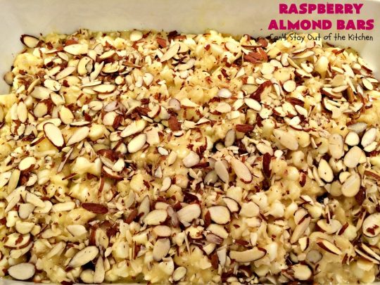 Raspberry Almond Bars | Can't Stay Out of the Kitchen | these irresistible #brownies are rich, decadent & absolutely sensational! They're perfect for #holiday & #Christmas #baking as they are so festive & beautiful. These layered #cookies use vanilla chips, #Raspberry preserves & #almonds. #holidaybaking #ChristmasCookieExchange #dessert #raspberrydessert
