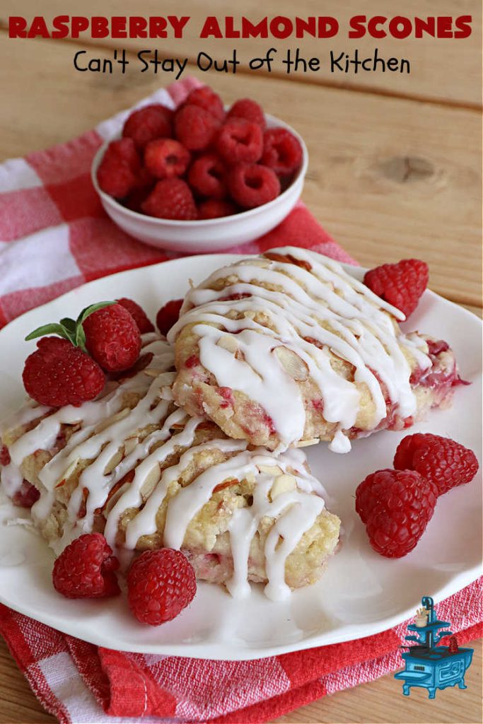 Raspberry Almond Scones | Can't Stay Out of the Kitchen | these delicious #scones are a perfect idea for a company or #holiday #breakfast, like #Thanksgiving or #Christmas. They're filled with fresh #raspberries, sliced #almonds & include #AlmondExtract in the batter as well as the icing. Every bite will rock your world! If you enjoy a sweet treat with your morning coffee, you'll love these! #RaspberryAlmondScones