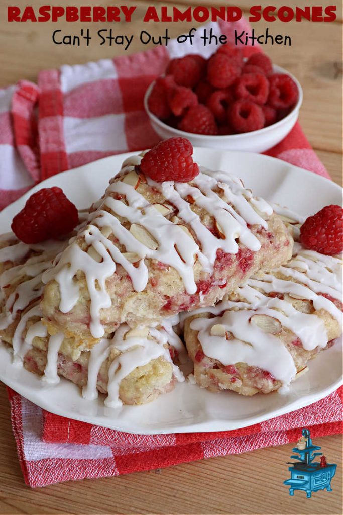 Raspberry Almond Scones | Can't Stay Out of the Kitchen | these delicious #scones are a perfect idea for a company or #holiday #breakfast, like #Thanksgiving or #Christmas. They're filled with fresh #raspberries, sliced #almonds & include #AlmondExtract in the batter as well as the icing. Every bite will rock your world! If you enjoy a sweet treat with your morning coffee, you'll love these! #RaspberryAlmondScones