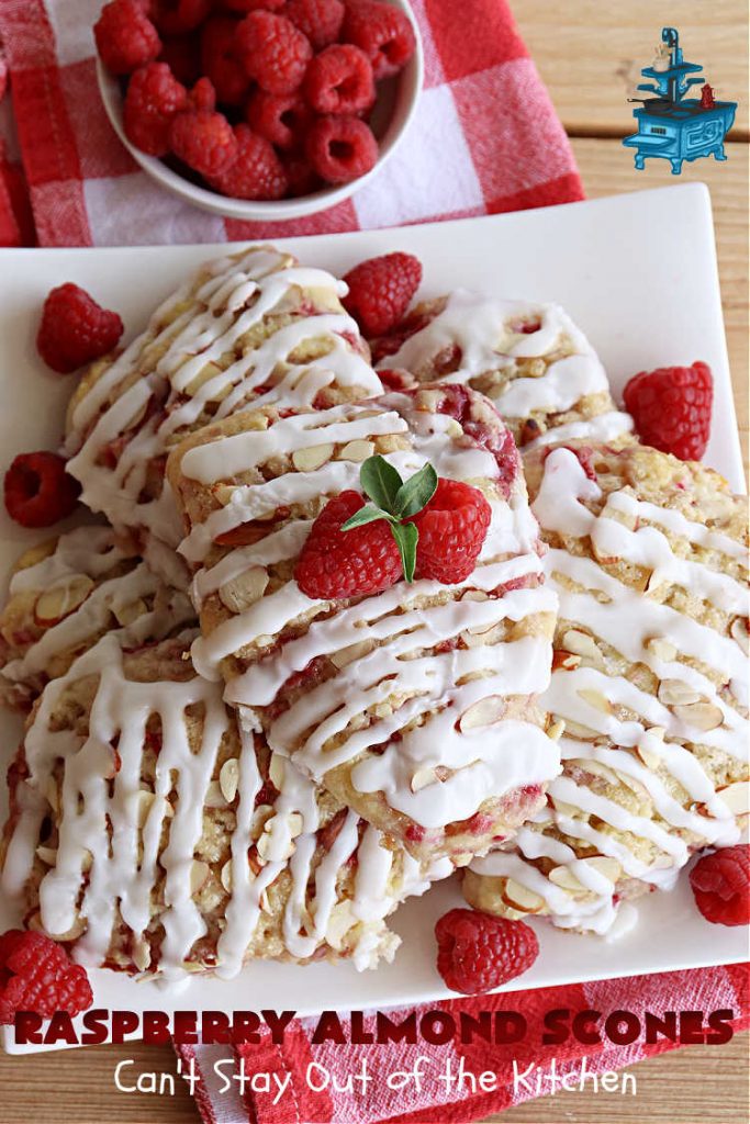 Raspberry Almond Scones | Can't Stay Out of the Kitchen | these delicious #scones are a perfect idea for a company or #holiday #breakfast, like #Thanksgiving or #Christmas. They're filled with fresh #raspberries, sliced #almonds & include #AlmondExtract in the batter as well as the icing. Every bite will rock your world! If you enjoy a sweet treat with your morning coffee, you'll love these! #RaspberryAlmondScones