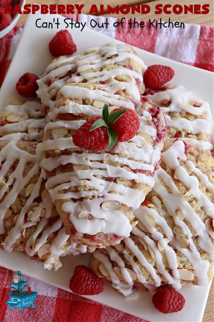 Raspberry Almond Scones | Can't Stay Out of the Kitchen | these delicious #scones are a perfect idea for a company or #holiday #breakfast, like #Thanksgiving or #Christmas. They're filled with fresh #raspberries, sliced #almonds & include #AlmondExtract in the batter as well as the icing. Every bite will rock your world! If you enjoy a sweet treat with your morning coffee, you'll love these! #RaspberryAlmondScones