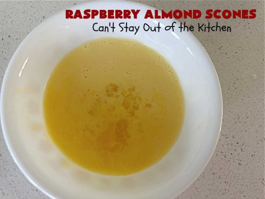 Raspberry Almond Scones | Can't Stay Out of the Kitchen | these delicious #scones are a perfect idea for a company or #holiday #breakfast, like #Thanksgiving or #Christmas. They're filled with fresh #raspberries, sliced #almonds & include #AlmondExtract in the batter as well as the icing. Every bite will rock your world! If you enjoy a sweet treat with your morning coffee, you'll love these! #RaspberryAlmondSconesRaspberry Almond Scones | Can't Stay Out of the Kitchen | these delicious #scones are a perfect idea for a company or #holiday #breakfast, like #Thanksgiving or #Christmas. They're filled with fresh #raspberries, sliced #almonds & include #AlmondExtract in the batter as well as the icing. Every bite will rock your world! If you enjoy a sweet treat with your morning coffee, you'll love these! #RaspberryAlmondScones