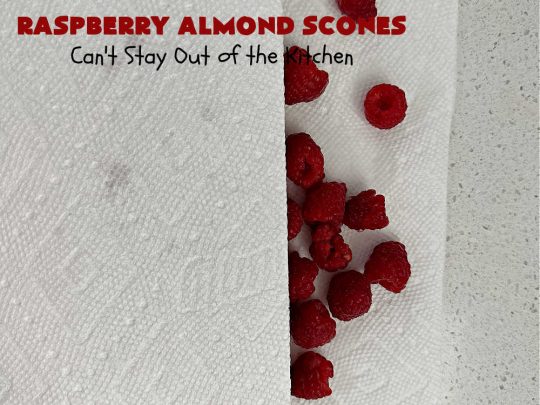 Raspberry Almond Scones | Can't Stay Out of the Kitchen | these delicious #scones are a perfect idea for a company or #holiday #breakfast, like #Thanksgiving or #Christmas. They're filled with fresh #raspberries, sliced #almonds & include #AlmondExtract in the batter as well as the icing. Every bite will rock your world! If you enjoy a sweet treat with your morning coffee, you'll love these! #RaspberryAlmondScones