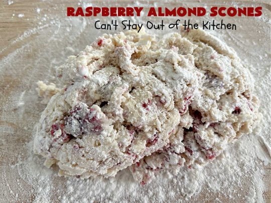 Raspberry Almond Scones | Can't Stay Out of the Kitchen | these delicious #scones are a perfect idea for a company or #holiday #breakfast, like #Thanksgiving or #Christmas. They're filled with fresh #raspberries, sliced #almonds & include #AlmondExtract in the batter as well as the icing. Every bite will rock your world! If you enjoy a sweet treat with your morning coffee, you'll love these! #RaspberryAlmondScones
