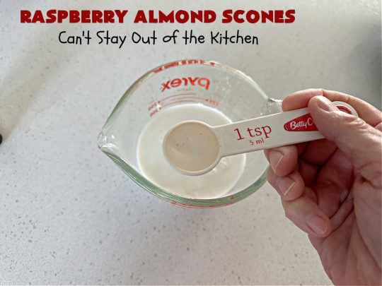 Raspberry Almond Scones | Can't Stay Out of the Kitchen | these delicious #scones are a perfect idea for a company or #holiday #breakfast, like #Thanksgiving or #Christmas. They're filled with fresh #raspberries, sliced #almonds & include #AlmondExtract in the batter as well as the icing. Every bite will rock your world! If you enjoy a sweet treat with your morning coffee, you'll love these! #RaspberryAlmondScones