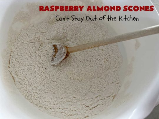 Raspberry Almond Scones | Can't Stay Out of the Kitchen | these delicious #scones are a perfect idea for a company or #holiday #breakfast, like #Thanksgiving or #Christmas. They're filled with fresh #raspberries, sliced #almonds & include #AlmondExtract in the batter as well as the icing. Every bite will rock your world! If you enjoy a sweet treat with your morning coffee, you'll love these! #RaspberryAlmondScones