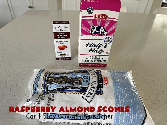 Raspberry Almond Scones | Can't Stay Out of the Kitchen | these delicious #scones are a perfect idea for a company or #holiday #breakfast, like #Thanksgiving or #Christmas. They're filled with fresh #raspberries, sliced #almonds & include #AlmondExtract in the batter as well as the icing. Every bite will rock your world! If you enjoy a sweet treat with your morning coffee, you'll love these! #RaspberryAlmondScones