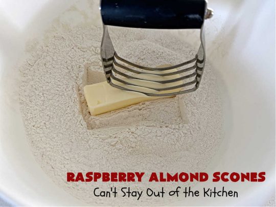 Raspberry Almond Scones | Can't Stay Out of the Kitchen | these delicious #scones are a perfect idea for a company or #holiday #breakfast, like #Thanksgiving or #Christmas. They're filled with fresh #raspberries, sliced #almonds & include #AlmondExtract in the batter as well as the icing. Every bite will rock your world! If you enjoy a sweet treat with your morning coffee, you'll love these! #RaspberryAlmondScones