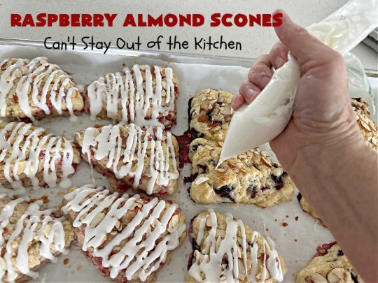 Raspberry Almond Scones | Can't Stay Out of the Kitchen | these delicious #scones are a perfect idea for a company or #holiday #breakfast, like #Thanksgiving or #Christmas. They're filled with fresh #raspberries, sliced #almonds & include #AlmondExtract in the batter as well as the icing. Every bite will rock your world! If you enjoy a sweet treat with your morning coffee, you'll love these! #RaspberryAlmondScones