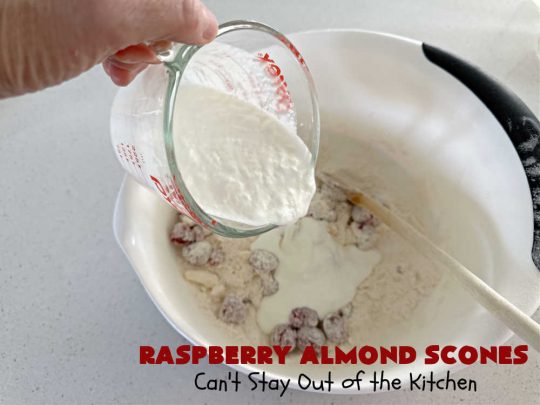 Raspberry Almond Scones | Can't Stay Out of the Kitchen | these delicious #scones are a perfect idea for a company or #holiday #breakfast, like #Thanksgiving or #Christmas. They're filled with fresh #raspberries, sliced #almonds & include #AlmondExtract in the batter as well as the icing. Every bite will rock your world! If you enjoy a sweet treat with your morning coffee, you'll love these! #RaspberryAlmondScones