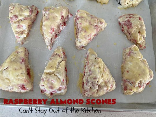 Raspberry Almond Scones | Can't Stay Out of the Kitchen | these delicious #scones are a perfect idea for a company or #holiday #breakfast, like #Thanksgiving or #Christmas. They're filled with fresh #raspberries, sliced #almonds & include #AlmondExtract in the batter as well as the icing. Every bite will rock your world! If you enjoy a sweet treat with your morning coffee, you'll love these! #RaspberryAlmondScones