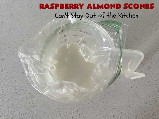 Raspberry Almond Scones | Can't Stay Out of the Kitchen | these delicious #scones are a perfect idea for a company or #holiday #breakfast, like #Thanksgiving or #Christmas. They're filled with fresh #raspberries, sliced #almonds & include #AlmondExtract in the batter as well as the icing. Every bite will rock your world! If you enjoy a sweet treat with your morning coffee, you'll love these! #RaspberryAlmondScones