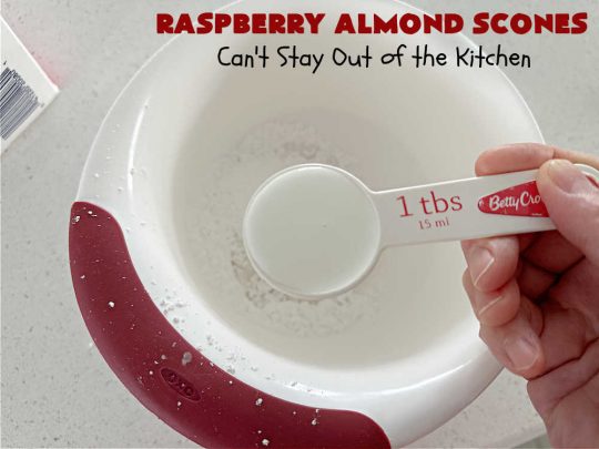 Raspberry Almond Scones | Can't Stay Out of the Kitchen | these delicious #scones are a perfect idea for a company or #holiday #breakfast, like #Thanksgiving or #Christmas. They're filled with fresh #raspberries, sliced #almonds & include #AlmondExtract in the batter as well as the icing. Every bite will rock your world! If you enjoy a sweet treat with your morning coffee, you'll love these! #RaspberryAlmondScones