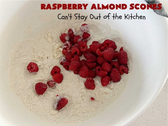 Raspberry Almond Scones | Can't Stay Out of the Kitchen | these delicious #scones are a perfect idea for a company or #holiday #breakfast, like #Thanksgiving or #Christmas. They're filled with fresh #raspberries, sliced #almonds & include #AlmondExtract in the batter as well as the icing. Every bite will rock your world! If you enjoy a sweet treat with your morning coffee, you'll love these! #RaspberryAlmondScones