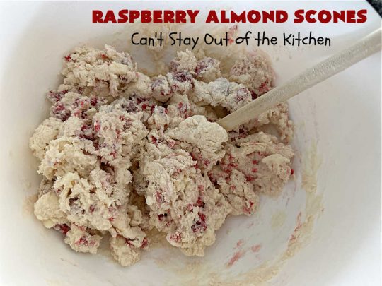 Raspberry Almond Scones | Can't Stay Out of the Kitchen | these delicious #scones are a perfect idea for a company or #holiday #breakfast, like #Thanksgiving or #Christmas. They're filled with fresh #raspberries, sliced #almonds & include #AlmondExtract in the batter as well as the icing. Every bite will rock your world! If you enjoy a sweet treat with your morning coffee, you'll love these! #RaspberryAlmondScones