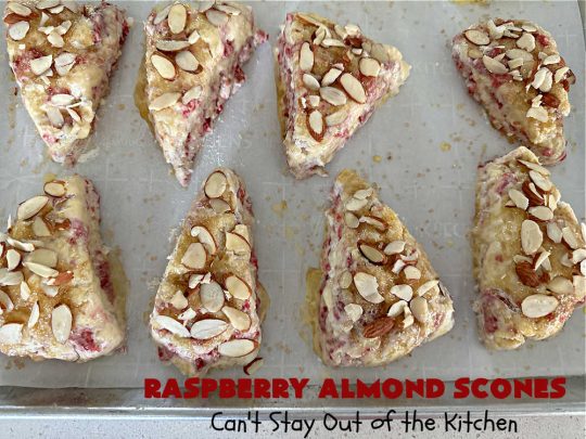 Raspberry Almond Scones | Can't Stay Out of the Kitchen | these delicious #scones are a perfect idea for a company or #holiday #breakfast, like #Thanksgiving or #Christmas. They're filled with fresh #raspberries, sliced #almonds & include #AlmondExtract in the batter as well as the icing. Every bite will rock your world! If you enjoy a sweet treat with your morning coffee, you'll love these! #RaspberryAlmondScones