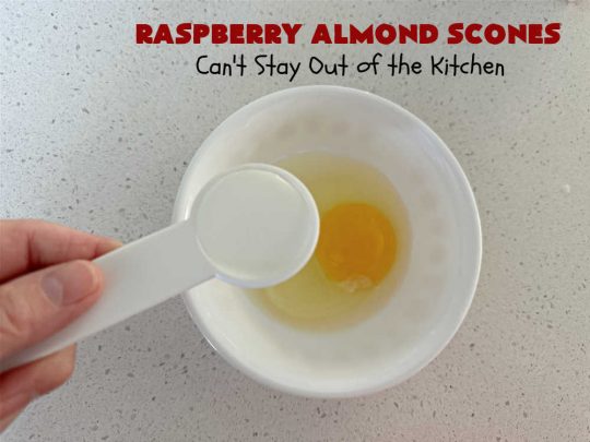 Raspberry Almond Scones | Can't Stay Out of the Kitchen | these delicious #scones are a perfect idea for a company or #holiday #breakfast, like #Thanksgiving or #Christmas. They're filled with fresh #raspberries, sliced #almonds & include #AlmondExtract in the batter as well as the icing. Every bite will rock your world! If you enjoy a sweet treat with your morning coffee, you'll love these! #RaspberryAlmondScones